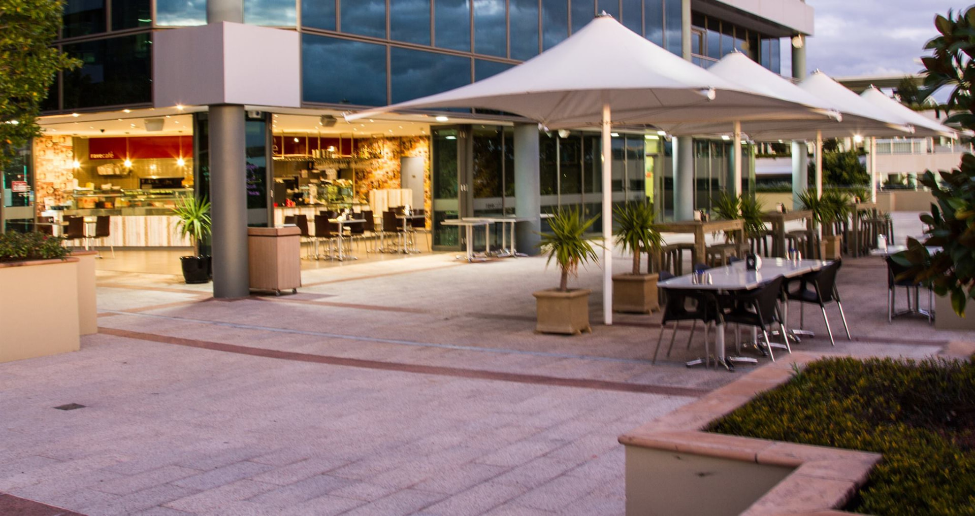 Kebabiya cafe front with outdoor seating at dusk