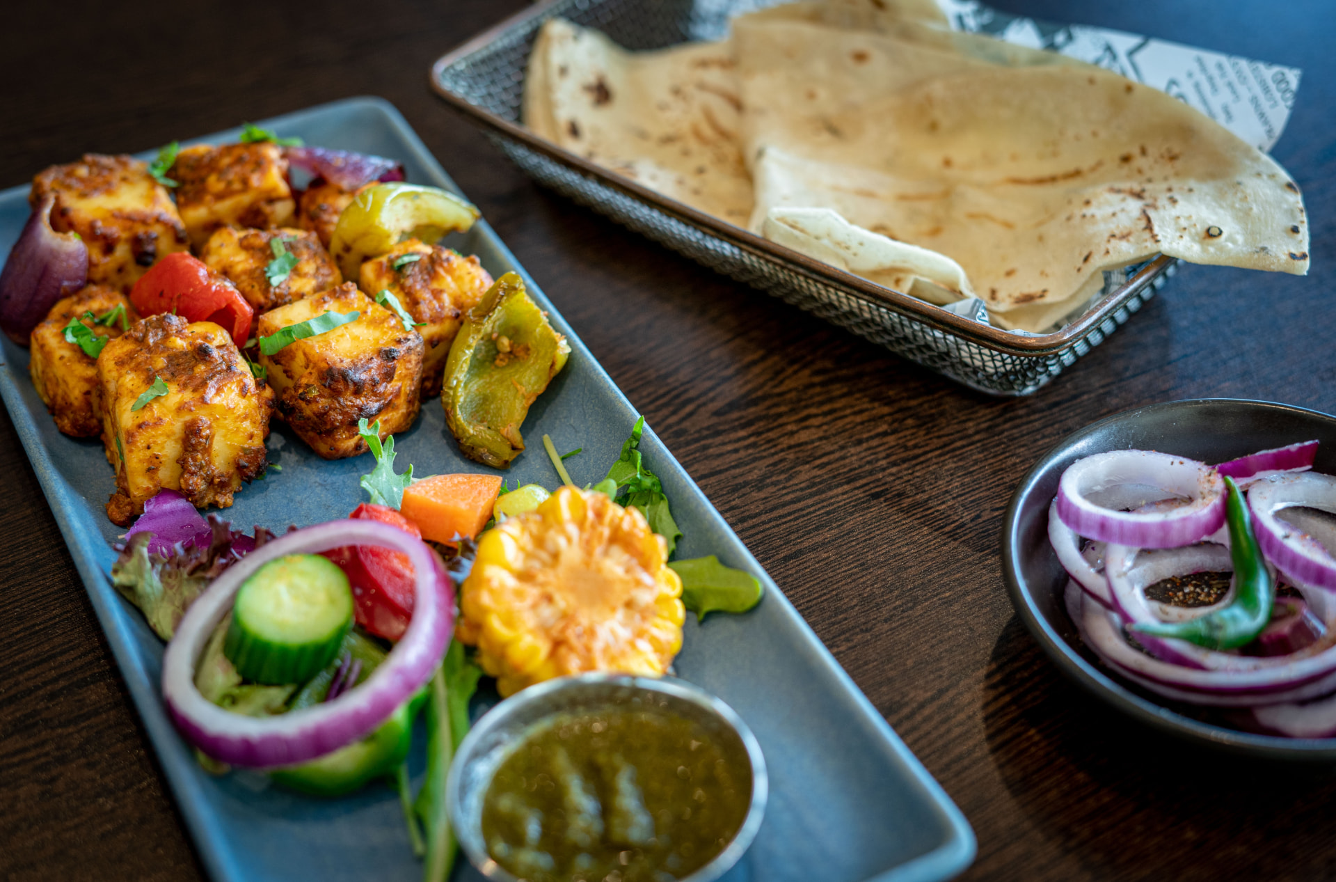 Original photograph of Paneer Anardana Kebab with peppers and chutneys