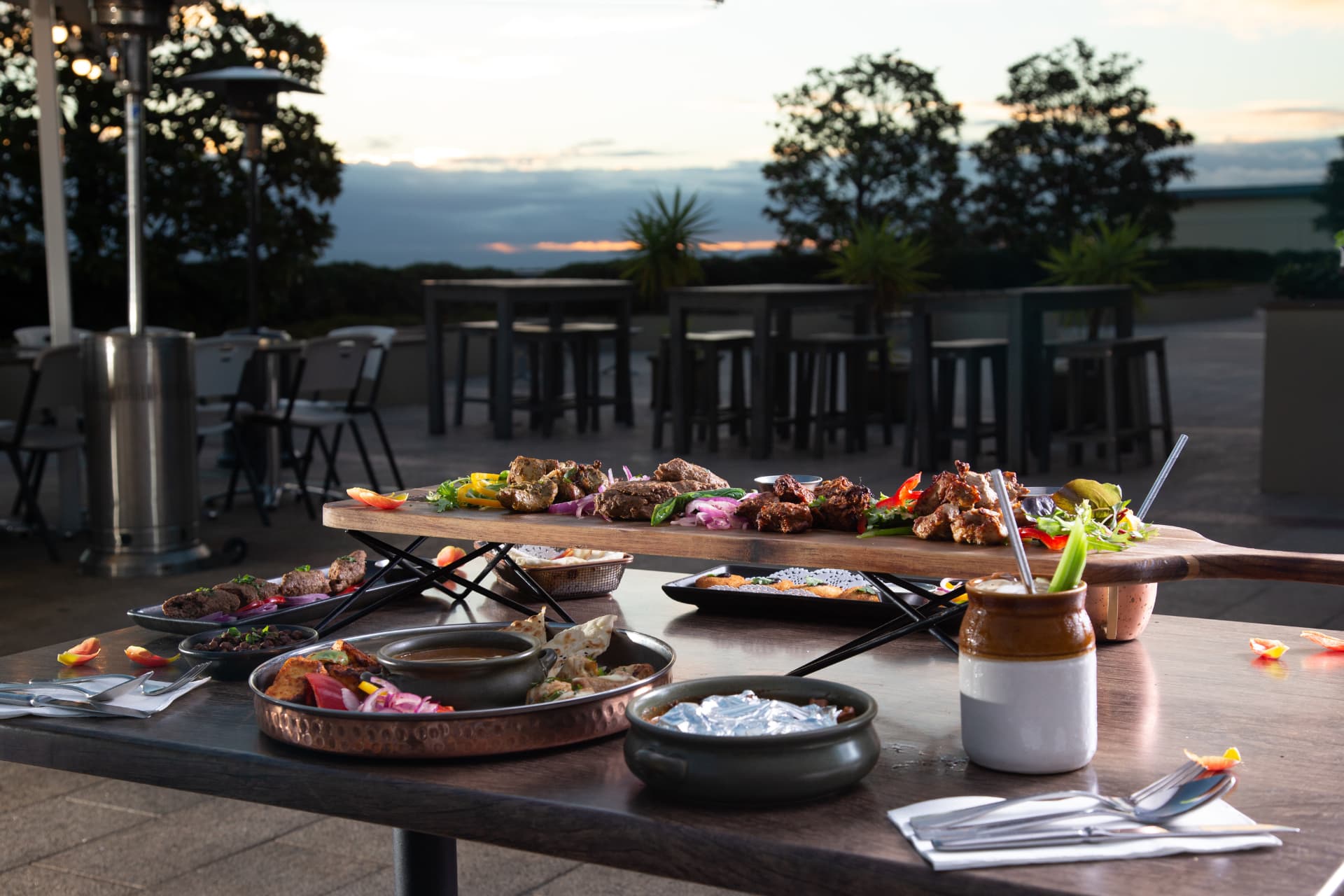 Kebab board and curries on the outdoor terrace