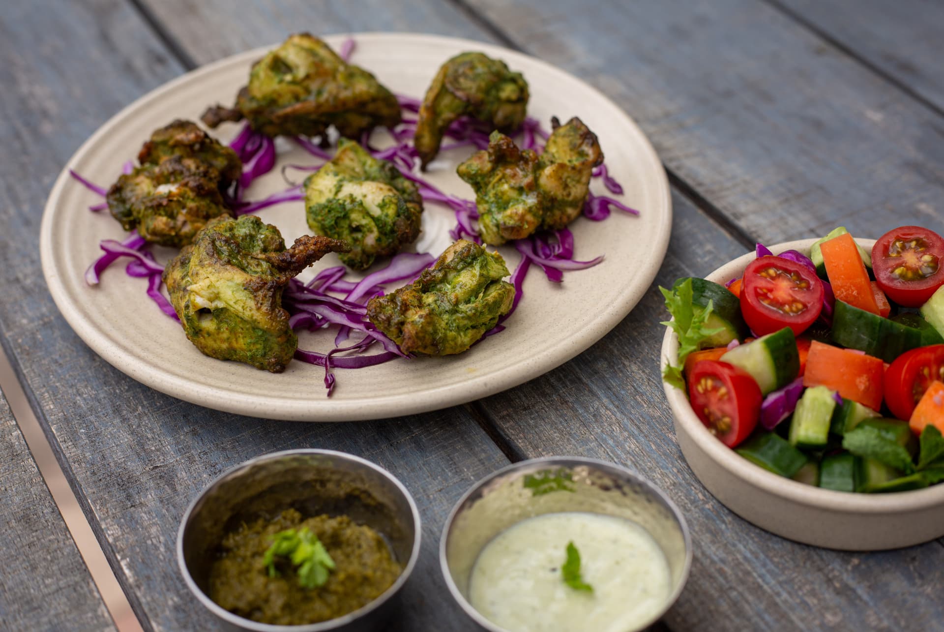 Original photograph of Hariyali Chooza with chutneys and salad