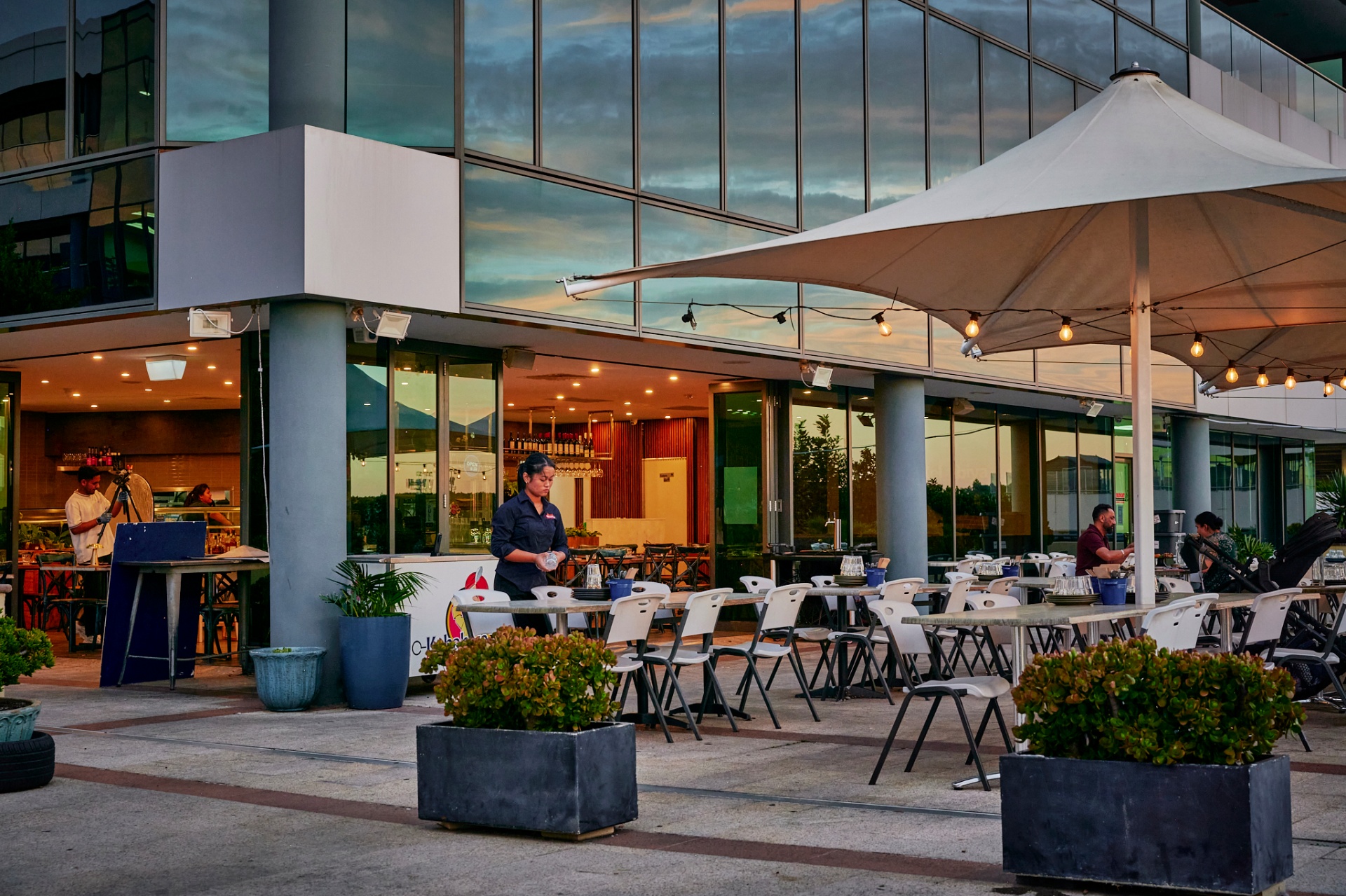 Kebabiya Bella Vista — open-air terrace at dusk with sail canopies, string lights and full tables
